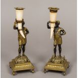 A pair of 19th century Blackamoor form candlesticks Each typically modelled,