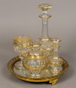 A 19th century gilt decorated cut glass bachelor's decanter set and tray Comprising: decanter and