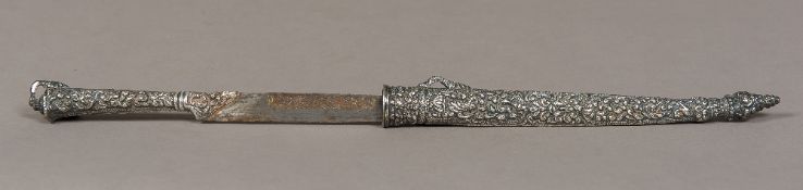 An Ottoman white metal (tests as silver) Kird The handle and sheath with foliate decoration,