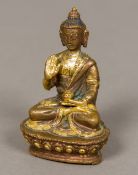 A Chinese cast gilt bronze figure of Buddha Typically worked on an integral plinth base. 8.