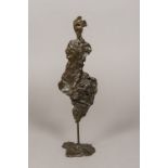 A contemporary abstract patinated bronze of figural form 37 cm high.