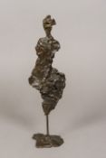 A contemporary abstract patinated bronze of figural form 37 cm high.