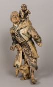 A 19th century Japanese polychrome painted carved wooden figural group Formed as a male figure with