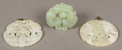 A Chinese carved jade roundel Depicting a male and female figure;