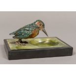 An early 20th century onyx and black slate pin tray Surmounted with a cold painted bronze model of