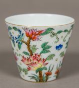 A Chinese porcelain wine cup Decorated with floral sprays,