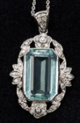 An antique 18 ct white gold aquamarine and diamond set pendant The central facet cut aquamarine