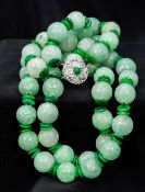 A Chinese carved jade bead necklace Of double strand form, with apple green jade spacers,