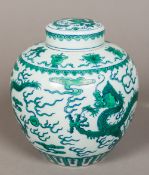 A Chinese porcelain ginger jar and cover Decorated with dragons chasing flaming pearls amongst