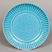 A Chinese porcelain plate Centrally worked with a dragon and a phoenix within a lappet border,