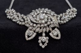 An 18 ct white gold diamond set necklace Variously articulated, the largest stone approximately 0.