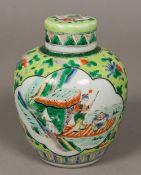 A Chinese porcelain ginger jar and cover Worked with figural vignettes on a green ground,