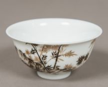 A Chinese porcelain bowl Decorated with a rock issuing bamboo opposing calligraphic script and red