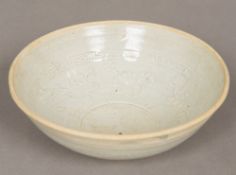 A Chinese Yuan type pottery bowl The interior relief decorated with floral sprays. 17 cm diameter.