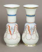 A pair of 19th century Continental milk glass vases Each decorated with foliate swags and lappet