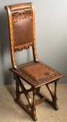 A 19th century North African bone inlaid side chair The pierced carved leather upholstered back