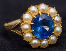 A Victorian 9 ct gold sapphire and pearl ring The central cornflower blue sapphire surrounded by a