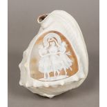 A cameo carved conch shell The shell of typical form, one side carved with three classical maidens.