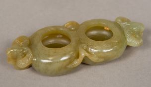 A small Chinese carved jade double brush washer The twin recesses flanked by ram's mask handles.