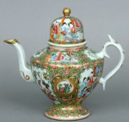 A 19th century Cantonese famille rose teapot The domed lid above the tapering body decorated with