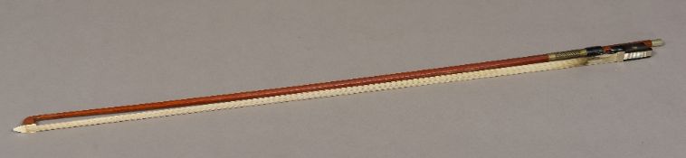 A 19th century German violin bow, stamped J Knopf 74.5 cm long.