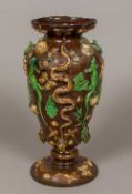 A 19th century majolica vase Of flared bulbous form, decorated in relief with various lizards,