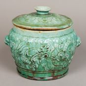 A Chinese pottery twin handles lidded vessel Relief moulded with a dragon opposing a phoenix