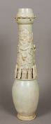A large Chinese Song Dynasty celadon glazed pottery funerary vase With applied figural decoration.