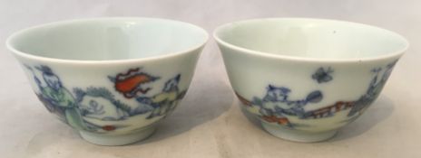 A pair of Chinese Republic period Doucai porcelain wine cups Each decorated with boys at play in a