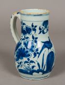A late 17th/early 18th century English blue and white Delft pottery flagon Decorated with a bird