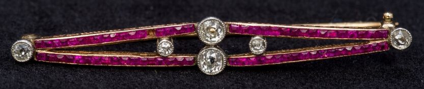 An Art Deco unmarked gold, diamond and ruby bar brooch Of pieced navette form,