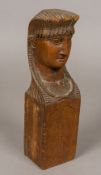 A French Empire carved wooden bust Of female form, wearing a headdress, above a panelled block.