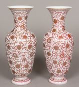 A pair of Niderviller type porcelain vases Each decorated with flowering foliate scrolls with gilt