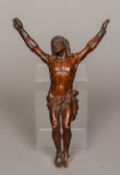 An 18th century Continental carved and stained softwood figure of Christ 29 cm long.