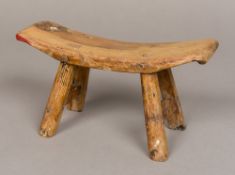 A Chinese miniature bench The shallow curved seat supported on splayed legs united with stretchers.