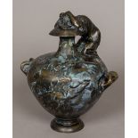 After the Antique A bronze funerary twin handled urn Cast with a winged putto and mounted with a