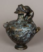 After the Antique A bronze funerary twin handled urn Cast with a winged putto and mounted with a