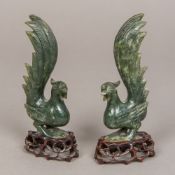 A pair of Chinese carved spinach jade exotic birds Naturalistically worked,