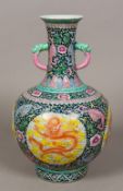 A Chinese famille verte porcelain vase Of twin handled bulbous form,