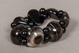 A agate and banded agate bracelet Of cut and beaded form. Approximately 17 cm long.
