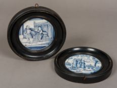 A pair of 18th century Dutch blue and white Delft circular plaques One worked with figures in a