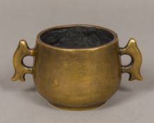 A Chinese bronze twin handled censer Of typical form, with cast four character mark to base. 8.