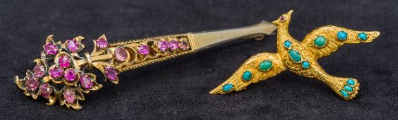 An antique turquoise set high carat gold brooch Worked as a bird in flight with hand engraved