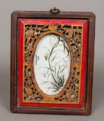 A Chinese porcelain plaque Worked with a grasshopper amongst grasses and with calligraphic text and