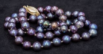 A lustre pearl bead necklace With 14 ct gold clasp. 42 cm long.