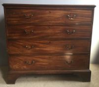 A George III mahogany chest of drawers The moulded rectangular top above four graduated drawers