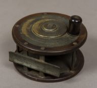 An Eaton & Deller (6 & 7 Crooked Lane, London) ebonite/brass revolving plate trout reel 11.