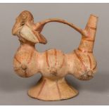 A South American pottery vessel Formed as three gourds beneath the loop handle joining a bird and