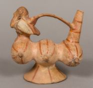 A South American pottery vessel Formed as three gourds beneath the loop handle joining a bird and