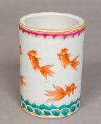 A Chinese porcelain brush pot Decorated with goldfish above stylised waves,